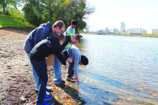 Photo of students collecting water at the Hudson River